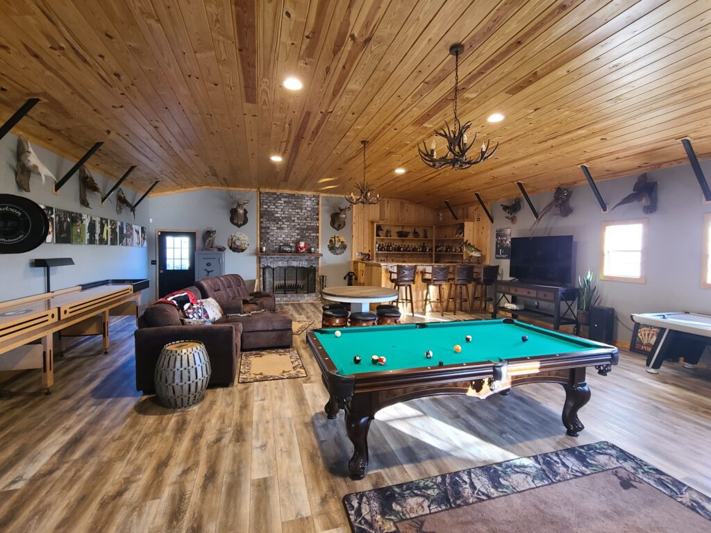 A pool table in the middle of a room.