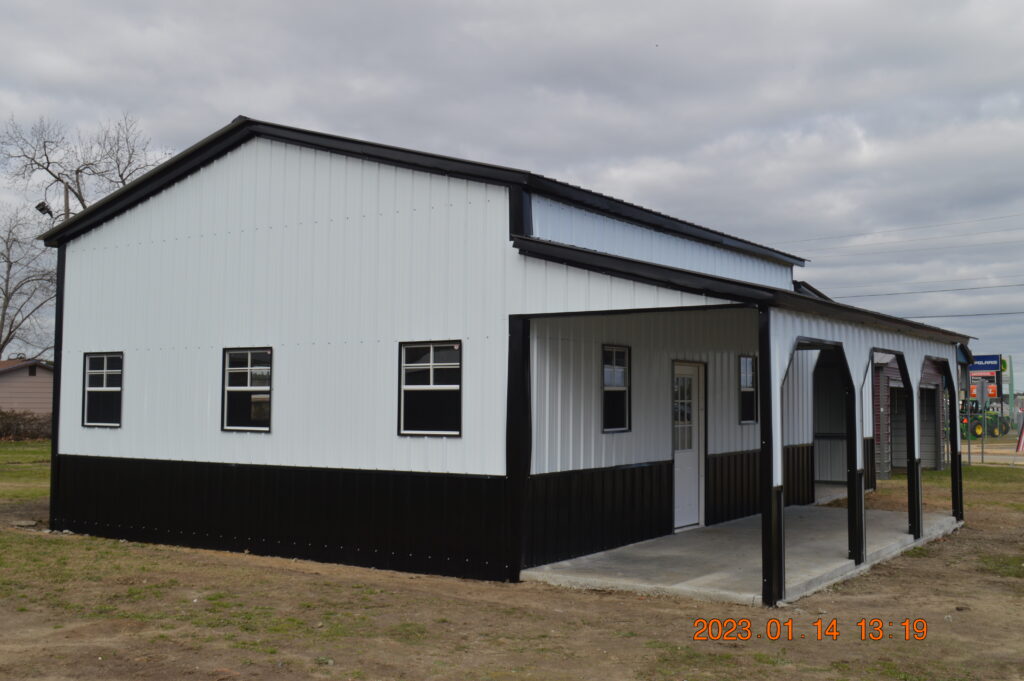 A white and black building with a porch.