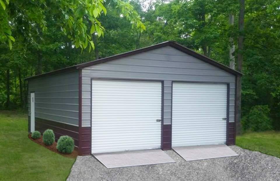 A two car garage with a metal roof.