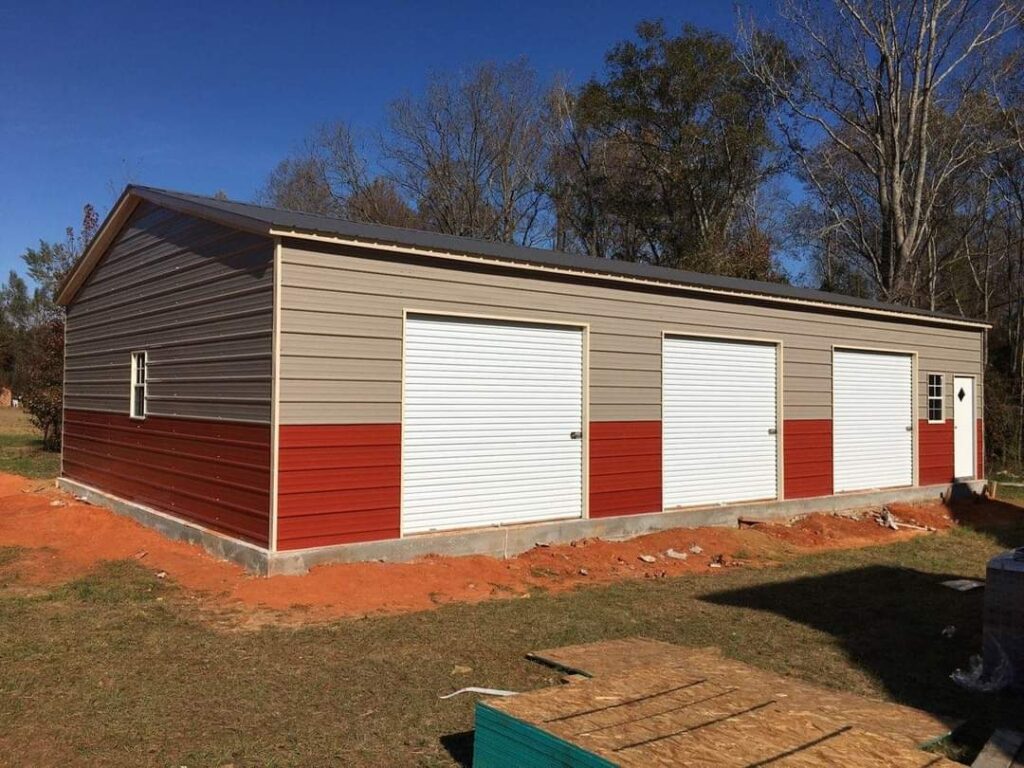 A three car garage with red and white trim.