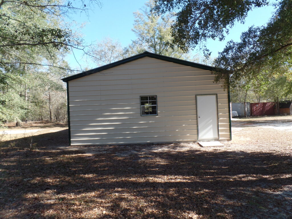 A white building with black trim and windows.