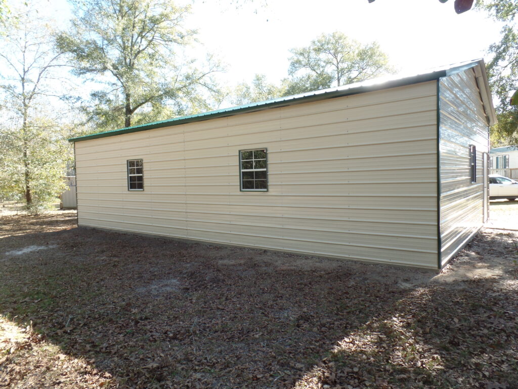 A large white building with two windows on the side.