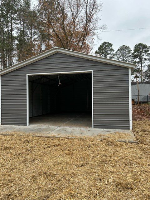 A gray garage with white trim and concrete floor.