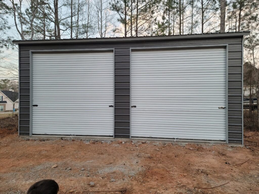 A double garage door in the middle of a field.