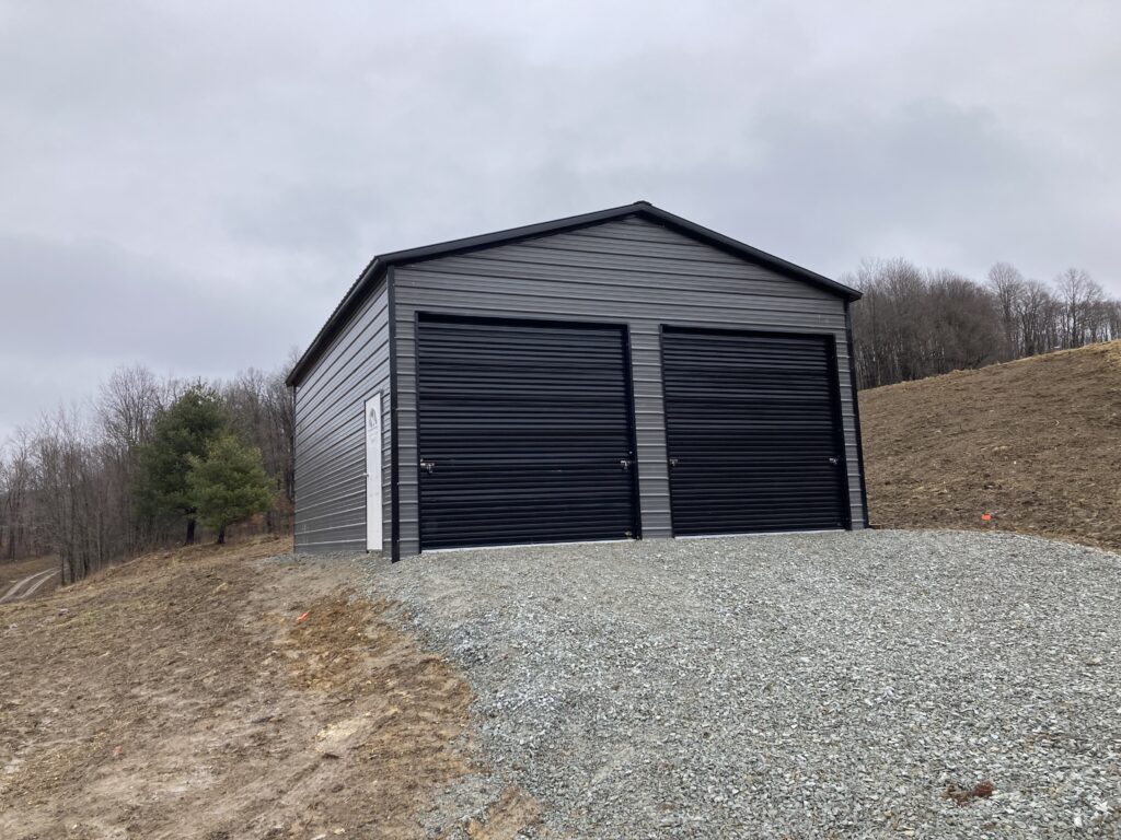 A metal building with two garage doors.